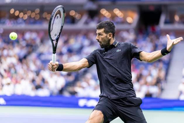 Novak Djokovic of Serbia returns a ball to Cameron Norrie of Great Britain in the third round in Arthur Ashe Stadium on day 6 at the 2025 US Open Tennis Championship at the USTA Billie Jean King National Tennis Center in New York City on Friday, August 29, 2025.  NYP20250829801 COREYxSIPKIN