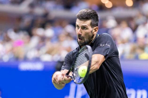 Novak Djokovic of Serbia returns a ball to Cameron Norrie of Great Britain in the third round in Arthur Ashe Stadium on day 6 at the 2025 US Open Tennis Championship at the USTA Billie Jean King National Tennis Center in New York City on Friday, August 29, 2025.  NYP20250829824 COREYxSIPKIN