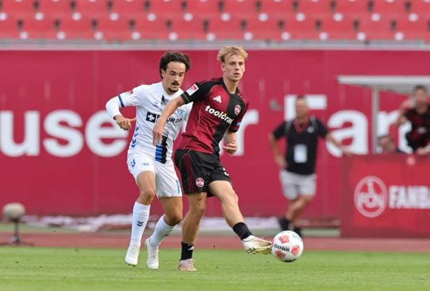 29 08 2025 Soccer Season 2025 2026 2 Soccer Bundesliga 04 Matchday 1 FC Nürnberg FCN Club SC Paderborn 07 SCP Sportfoto Zink DaMa xdaxmax DFL regulations prohibit any use of photographs as image sequences and or quasi video only for editorial use Mika Baur 14, SC Paderborn 07 Tim Janisch 32, 1 FC Nürnberg FCN