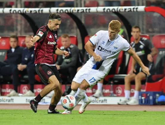 29 08 2025 Soccer Season 2025 2026 2 Soccer Bundesliga 04 Matchday 1 FC Nürnberg FCN Club SC Paderborn 07 SCP Sportfoto Zink DaMa xdaxmax DFL regulations prohibit any use of photographs as image sequences and or quasi video only for editorial use Berkay Yilmaz 21, 1 FC Nürnberg FCN Laurin Curda 17, SC Paderborn 07