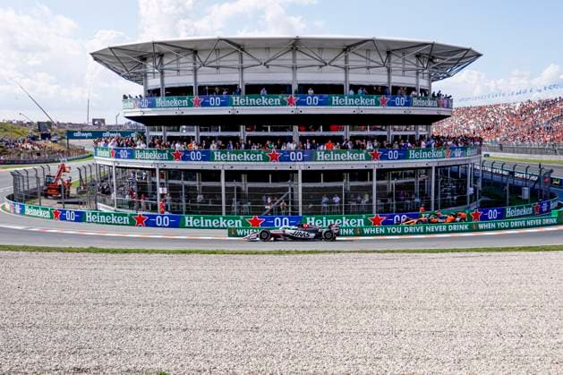 Oliver Bearman of the United Kingdom and Haas F1 Team and Lando Norris of the United Kingdom and McLaren F1 Team come out of the pit during the Free Practice of the Formula 1 Heineken Dutch Grand Prix 2025 on Day 2 at Circuit Zandvoort on August 30, 2025 in Zandvoort, Netherlands Photo by Marcel ter Bals DeFodi Images