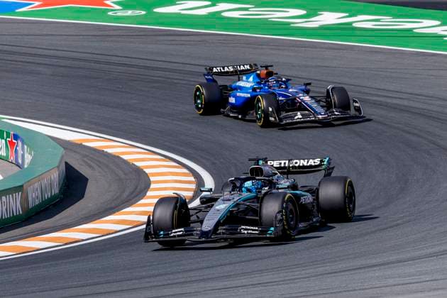 George Russell of the United Kingdom and Mercedes AMG Petronas F1 Team and Alexander Albon of Thailand and Williams during the Free Practice of the Formula 1 Heineken Dutch Grand Prix 2025 on Day 2 at Circuit Zandvoort on August 30, 2025 in Zandvoort, Netherlands Photo by Marcel ter Bals DeFodi Images