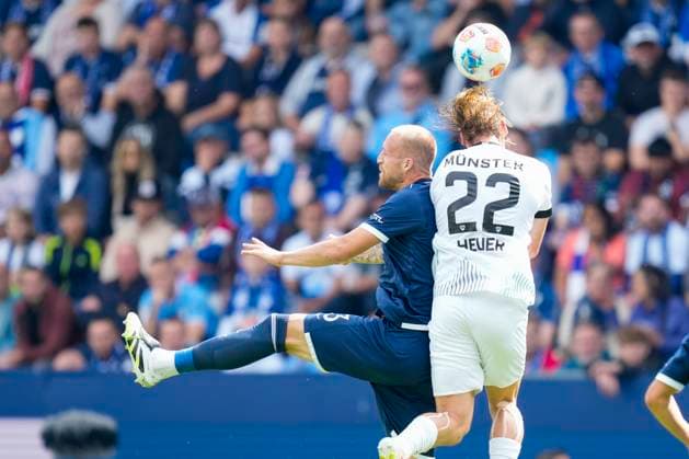 Philipp Hofmann VfL Bochum and Jannis Heuer Preußen Münster battle for the ball during the 2 Bundesliga match between VfL Bochum and Preußen Münster, Vonovia Ruhrstadion on August 30, 2025 in Bochum, Germany Photo by Alex Gottschalk DeFodi Images Philipp Hofmann VfL Bochum and Jannis Heuer Preußen Münster battle for the ball during the 2 Bundesliga match between VfL Bochum and Preußen Münster at Vonovia Ruhrstadion on August 30, 2025 in Bochum, Germany Photo by Alex Gottschalk DeFodi Images DFB DFL REGULATIONS PROHIBIT ANY USE OF PHOTOGRAPHS AS IMAGE SEQUENCES AND OR QUASI VIDEO Photo by Alex Gottschalk DeFodi Images DFB DFL REGULATIONS PROHIBIT ANY USE OF PHOTOGRAPHS AS IMAGE SEQUENCES AND OR QUASI VIDEO