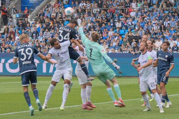 Penalty area scene Johannes Schenk Preussen Muenster 1 thwarts goal chance by Cajetan Lenz Bochum 34 30 08 2025 Football VfL Bochum vs SC Preussen Muenster, Vonovia Ruhrstadion, Bochum, DFB DFL REGULATIONS PROHIBIT ANY USE OF PHOTOGRAPHS AS IMAGE SEQUENCES AND OR QUASI VIDEO Copyright: xpepphotox xHorstxMauelshagenx pep00321, pep_20250830_hm_115966