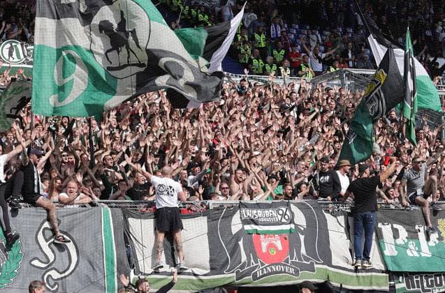 Fans of Hannover celebrate their team Football, Men, Season 2025 2026, 2 BL, Holstein Stadion, Holstein Kiel vs Hannover 96, 1 2 DFL REGULATIONS PROHIBIT ANY USE OF PHOTOGRAPHS AS IMAGE SEQUENCES AND OR QUASI VIDEO