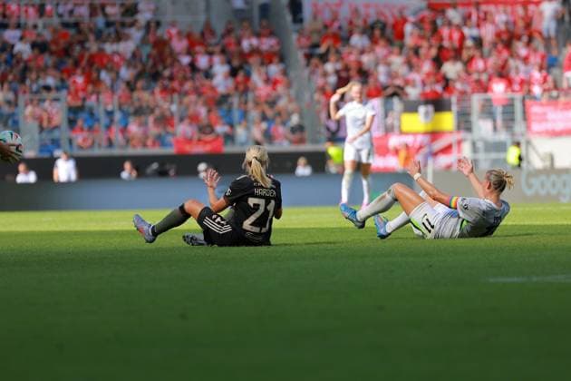 Pernille Harder 21 FC Bayern Women 1 and Alexandra Popp 11 VFL lie on the ground after a duel Football I Women I Season 2025 2026 I Supercup I FC Bayern Munich - VFL Wolfsburg I 29 08 2025 Copyright: xMaxxMesterx