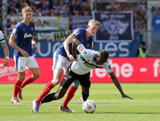 Alexander Bernhardsson Holstein Kiel , Mustapha Bundu Hannover 96 Football, Men, Season 2025 2026, 2 BL, Holstein Stadion, Holstein Kiel vs Hannover 96, 1 2 DFL REGULATIONS PROHIBIT ANY USE OF PHOTOGRAPHS AS IMAGE SEQUENCES AND OR QUASI VIDEO