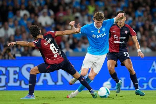 Sebastiano Luperto (Cagliari Calcio) and Scott McTominay (SSC Napoli) battle for the ball, Serie A, SSC Napoli v Cagliari Calcio, Diego Maradona Stadium, August 30, 2025, Naples, Italy.