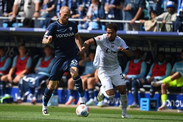 Philipp HOFMANN BO vs Etienne AMENYIDO MS Action, Duel, Football 2 Bundesliga, Matchday 4, matchday 4, VfL Bochum BO SC Preussen Muenster MS 1 2 on 30 08 2025, Vonovia Ruhrstadion Bochum Germany DFL regulations prohibit any use of photographs as image sequences and or quasi video Â