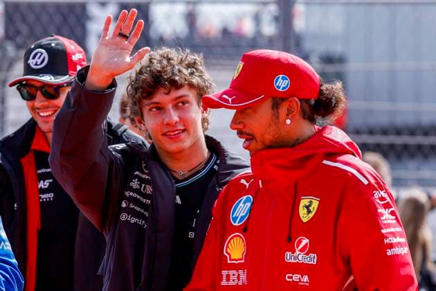 Drivers Parade Andrea Kimi Antonelli of Italy and Mercedes AMG Petronas F1 Team wave and Lewis Hamilton of the United Kingdom and Scuderia Ferrari HP F1 Team looks on during the Formula 1 Heineken Dutch Grand Prix 2025 on Day 3 at Circuit Zandvoort on August 31, 2025 in Zandvoort, Netherlands Photo by Marcel ter Bals DeFodi Images