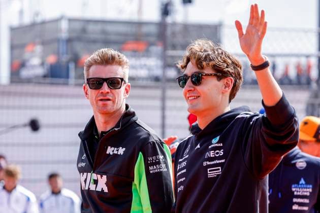 Drivers Parade Nico Hülkenberg of Germany and Stake F1 Team Kick Sauber looks on and George Russell of the United Kingdom and Mercedes AMG Petronas F1 Team wave during the Formula 1 Heineken Dutch Grand Prix 2025 on Day 3 at Circuit Zandvoort on August 31, 2025 in Zandvoort, Netherlands Photo by Marcel ter Bals DeFodi Images