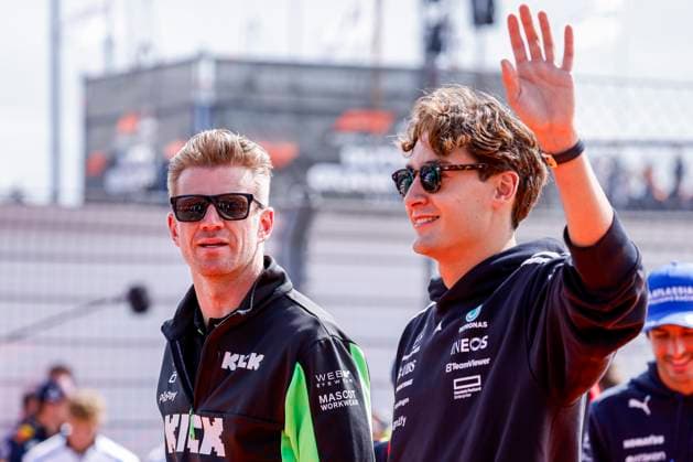 Drivers Parade Nico Hülkenberg of Germany and Stake F1 Team Kick Sauber looks on and George Russell of the United Kingdom and Mercedes AMG Petronas F1 Team wave during the Formula 1 Heineken Dutch Grand Prix 2025 on Day 3 at Circuit Zandvoort on August 31, 2025 in Zandvoort, Netherlands Photo by Marcel ter Bals DeFodi Images