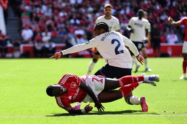 Nottingham, England, 31st August 2025. Callum Hudson-Odoi of Nottingham Forest goes down under the challenge from Kyle Walker-Peters of West Ham United but nothing is given during the Nottingham Forest vs West Ham United Premier League match at the City Ground, Nottingham. Picture credit should read: James Baylis Sportimage EDITORIAL USE ONLY. No use with unauthorised audio, video, data, fixture lists, club league logos or live services. Online in-match use limited to 120 images, no video emulation. No use in betting, games or single club league player publications. SPI_028_JB_Forest_WestHam SPI-4100-0028