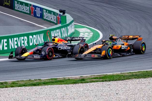 Lando Norris of the United Kingdom and McLaren F1 Team overtakes Max Verstappen of the Netherlands and Oracle Red Bull Racing during the Formula 1 Heineken Dutch Grand Prix 2025 on Day 3 at Circuit Zandvoort on August 31, 2025 in Zandvoort, Netherlands Photo by Marcel ter Bals DeFodi Images