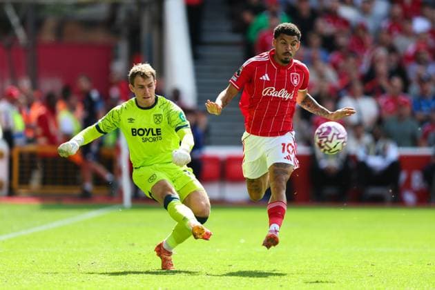 Nottingham, England, 31st August 2025. Mads Hermansen of West Ham United clears the ball whilst getting pressured by Morgan Gibbs-White of Nottingham Forest during the Nottingham Forest vs West Ham United Premier League match at the City Ground, Nottingham. Picture credit should read: James Baylis Sportimage EDITORIAL USE ONLY. No use with unauthorised audio, video, data, fixture lists, club league logos or live services. Online in-match use limited to 120 images, no video emulation. No use in betting, games or single club league player publications. SPI_030_JB_Forest_WestHam SPI-4100-0030