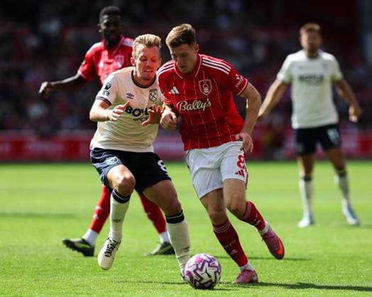 Nottingham, England, 31st August 2025. Elliot Anderson of Nottingham Forest runs with the ball whilst getting pressured by James Ward-Prowse of West Ham United during the Nottingham Forest vs West Ham United Premier League match at the City Ground, Nottingham. Picture credit should read: James Baylis Sportimage EDITORIAL USE ONLY. No use with unauthorised audio, video, data, fixture lists, club league logos or live services. Online in-match use limited to 120 images, no video emulation. No use in betting, games or single club league player publications. SPI_032_JB_Forest_WestHam SPI-4100-0032