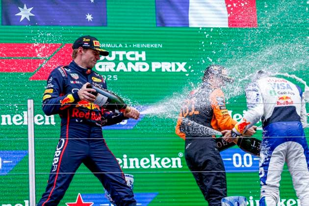 podium ceremony, Max Verstappen of the Netherlands and Oracle Red Bull Racing and Oscar Piastri of Australia and McLaren F1 Team and Isack Hadjar of France and Visa Cash App Racing Bulls spray champge during the Formula 1 Heineken Dutch Grand Prix 2025 on Day 3 at Circuit Zandvoort on August 31, 2025 in Zandvoort, Netherlands Photo by Marcel ter Bals DeFodi Images