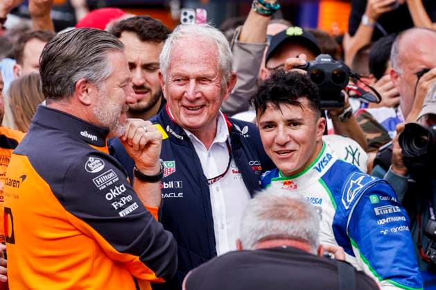 P3 finisher Isack Hadjar of France and Visa Cash App Racing Bulls is congratulated by Helmut Marko of Oracle Red Bull Racing and CEO of McLaren F1 Team Zak Brown during the Formula 1 Heineken Dutch Grand Prix 2025 on Day 3 at Circuit Zandvoort on August 31, 2025 in Zandvoort, Netherlands Photo by Marcel ter Bals DeFodi Images