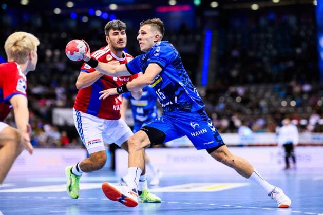 TVB Stuttgart HSV Hamburg Handball 1 Bundesliga, Men, Season 2025 2026, TVB Stuttgart HSV Hamburg, Porsche Arena Stuttgarts Simone Mengon r in action against Hamburgs Jacob Lassen l Stuttgart Porsche Arena Baden Württemberg Germany