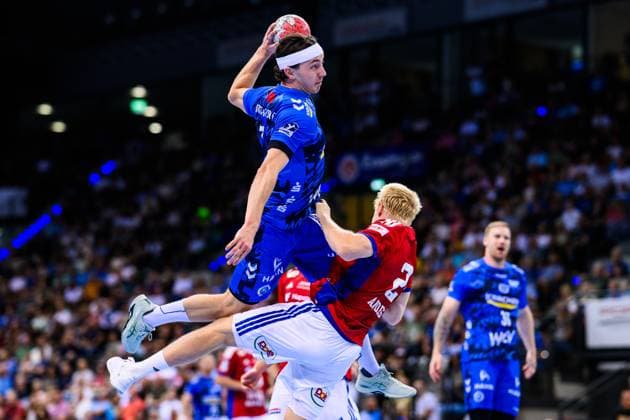 TVB Stuttgart HSV Hamburg Handball 1 Bundesliga, Men, Season 2025 2026, TVB Stuttgart HSV Hamburg, Porsche Arena Stuttgarts Kasper Lien l in action against Hamburgs Frederik Andersen r Stuttgart Porsche Arena Baden Württemberg Germany