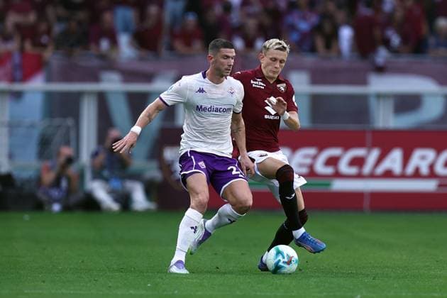 Robin Gosens (Acf Fiorentina) und Marcus Pedersen (Torino Fc) battle for the ball, Serie A, Torino FC v ACF Fiorentina, Olimpico, August 31, 2025, Turin, Italy.
