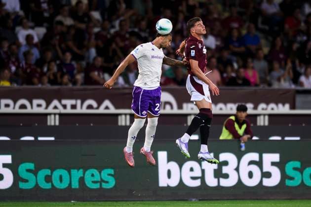 Torino FC v ACF Fiorentina - Serie A Cher Ndour of ACF Fiorentina competes for a header with Cesare Casadei of Torino FC during the Serie A football match between Torino FC and ACF Fiorentina. Turin Italy Copyright: xNicolòxCampox