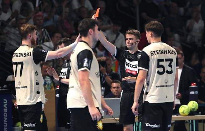 Red card for Johannes Wasielewski Upper body action Sport Handball HBL Bundesliga Men 1 Matchday Season 2025 2026 31 08 2025 Füchse Berlin vs Bergischer HC