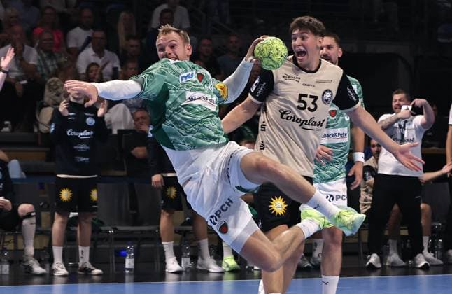 Mathias Gidsel on the ball, Sören Steinhaus duel Match scene Action Sport Handball HBL Bundesliga Men 1 Matchday Season 2025 2026 31 08 2025 Füchse Berlin vs Bergischer HC
