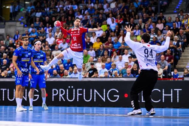 TVB Stuttgart HSV Hamburg Handball 1 Bundesliga, Men, Season 2025 2026, TVB Stuttgart HSV Hamburg, Porsche Arena Hamburgs Casper Mortensen l in action against Stuttgarts goalkeeper Daniel Rebmann r Stuttgart Porsche Arena Baden Württemberg Germany