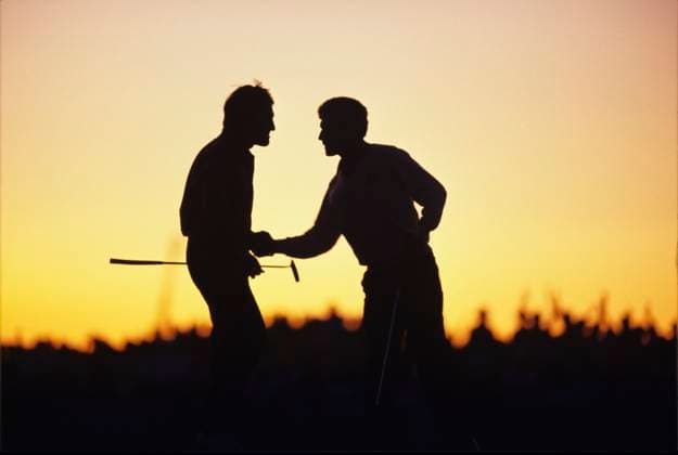 Seve Ballesteros and Jose Maria Olazabal at the end of the second day seve & olazabal congratulate each other after gaining a half on saturday evening on the 18th green silhouetted as the sun sets with a golden orange yellow glow 29th ryder cup september 1991 kiawah island, south carolina usa Ryder Cup 1991 29th SEPTEMBER 1991 KIAWA ISLAND, SOUTH CAROLINA USA The 1991 Ryder Cup at Kiawah Island Golf Resort in South Carolina is one of the most iconic and dramatic in the tournament s history. Often referred to as the War on the Shore, the event was defined by intense competition and remarkable individual performances. Copyright: xMarkxNewcombex