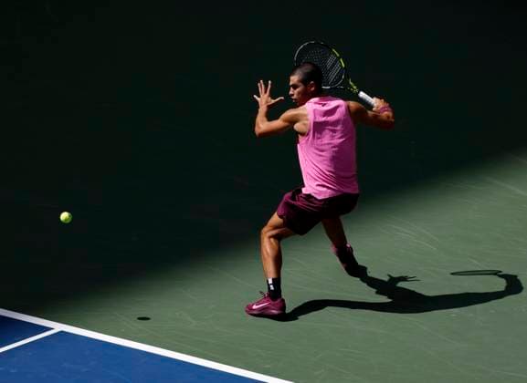 Carlos Alcaraz of Spain returns a ball to Jiri Lehecka of Czechia in the first set before defeating Lehecka in straight sets in their quarterfinal match in Arthur Ashe Stadium on day 10 at the 2025 US Open Tennis Championship at the USTA Billie Jean King National Tennis Center in New York City on Tuesday, September 2, 2025.  NYP20250902118 JOHNxANGELILLO