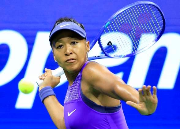 Naomi Osaka of Japan returns a ball to Karolina.Muchova of Czechia in the second set in their quarterfinal match in Arthur Ashe Stadium on day 11 at the 2025 US Open Tennis Championship at the USTA Billie Jean King National Tennis Center in New York City on Wednesday, September 3, 2025.  NYP20250903134 JOHNxANGELILLO
