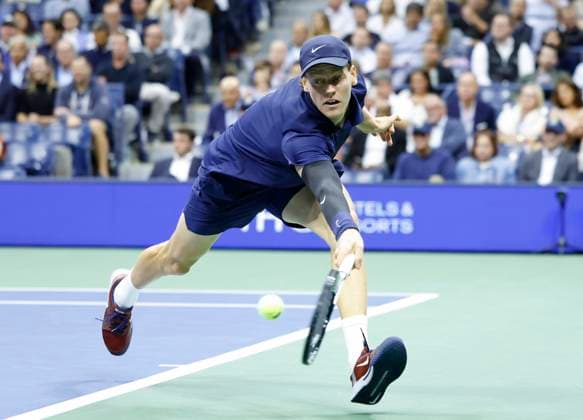 Jannik Sinner of Italy returns a ball to Lorenzo Musetti of Italy in the 3rd set of their quarterfinal match in Arthur Ashe Stadium on day 11 at the 2025 US Open Tennis Championship at the USTA Billie Jean King National Tennis Center in New York City on Wednesday, September 3, 2025.  NYP20250903145 JOHNxANGELILLO