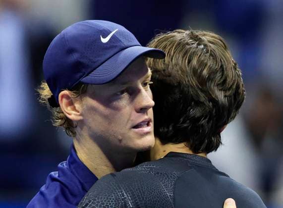 Jannik Sinner of Italy and Lorenzo Musetti of Italy meet at net after Sinner defeats Musetti in their quarterfinal match in Arthur Ashe Stadium on day 11 at the 2025 US Open Tennis Championship at the USTA Billie Jean King National Tennis Center in New York City on Wednesday, September 3, 2025.  NYP20250903154 JOHNxANGELILLO