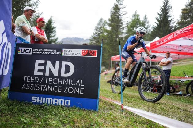 2025 UCI Mountain Bike World Championships Picture by Alex Whitehead SWpix.com - 04 09 2025 - Cycling - 2025 UCI Mountain Bike World Championships - E-MTB Cross-Country - Aletsch Arena Bellwald, Valais, Switzerland - Men Elite E-MTB Cross-country - Branding - Feed Zone Copyright: x xSWpix.comx(t axPhotographyxHubxLtd)xAlexxWhitehead SWpix.comx SWP-3030-1535
