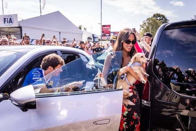 F1 ITALIAN GRAND PRIX FRIDAY Charles Leclerc of Monaco and Scuderia Ferrari cheers the fans with his girlfriend Alexandra Saint Mleux and his dog Leo ahead of friday s practice of the F1 Grand Prix of Italy - Formula 1 Pirelli Gran Premio D Italia 2025 at Autodromo Nazionale Monza Circuit on September 05, 2025, in Monza, Italy. Copyright: xx 080A3374