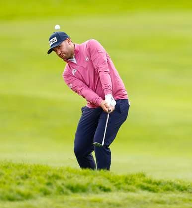 5th September 2025; The K Club, Straffan, County Kildare, Ireland: Amgen Irish Open Golf Second Round; Thriston Lawrence of South Africa chips his third shot onto the 18th green  PeterxFitzpatrick