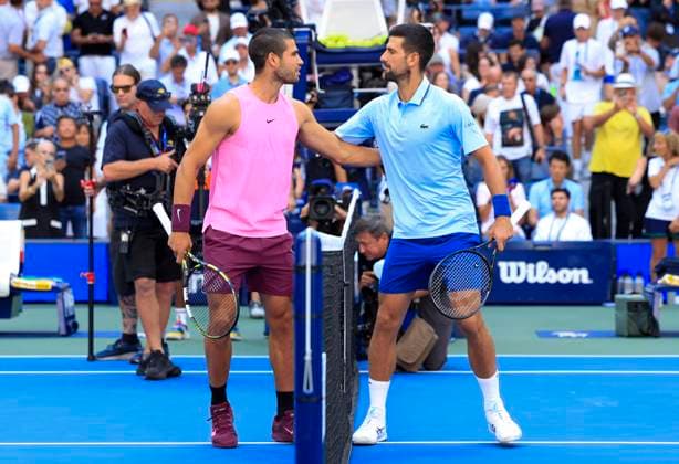 Novak Djokovic of Serbia (R) and Carlos Alcaraz of Spain greet each other before their Men s semifinal match at the 2025 US Open Tennis Championship at the USTA Billie Jean King National Tennis Center in New York City on Friday, September 5, 2025.  NYP20250905902 JOHNxANGELILLO