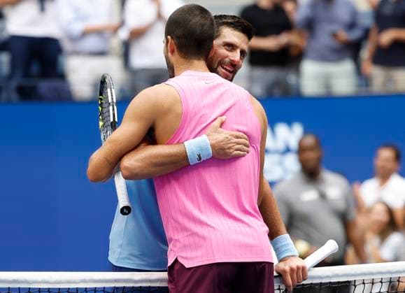 Novak Djokovic of Serbia congratulates Carlos Alcaraz of Spain after Alcaraz won their Men s semifinal match at the 2025 US Open Tennis Championship at the USTA Billie Jean King National Tennis Center in New York City on Friday, September 5, 2025. Alcaraz won 6-4, 7-6, 6-2 and advances to the finals on Sunday.  NYP20250905927 JOHNxANGELILLO