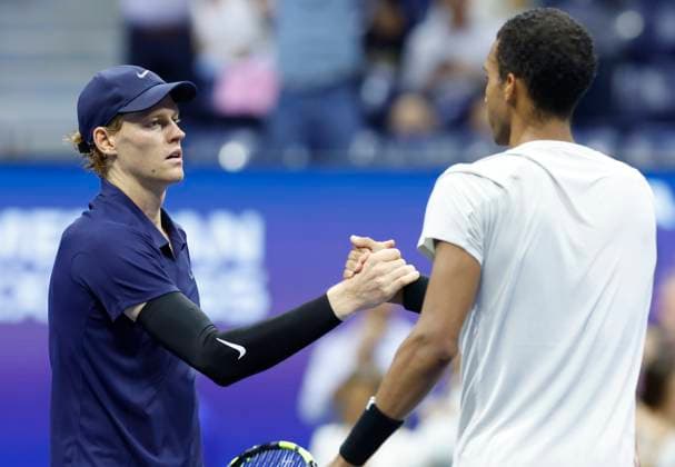 Felix Auger-Aliassime of Canada (R) congratulates Jannik Sinner of Italy after their Men s semifinal match at the 2025 US Open Tennis Championship at the USTA Billie Jean King National Tennis Center in New York City on Friday, September 5, 2025. Sinner won the match 6-1, 3-6, 6-3, 6-4 and will face Carlos Alcaraz of Spain in the finals on Sunday.  NYP20250905828 JOHNxANGELILLO