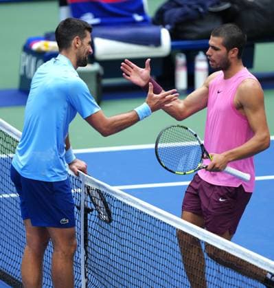 (250906) -- NEW YORK, Sept. 6, 2025 -- Carlos Alcaraz (R) greets Novak Djokovic after the men s singles semifinal match between Novak Djokovic of Serbia and Carlos Alcaraz of Spain at the 2025 US Open tennis championships in New York, the United States, Sept. 5, 2025. ) (SP)U.S.-NEW YORK-TENNIS-US OPEN-MEN S SINGLES-SEMIFINALS WuxXiaoling 