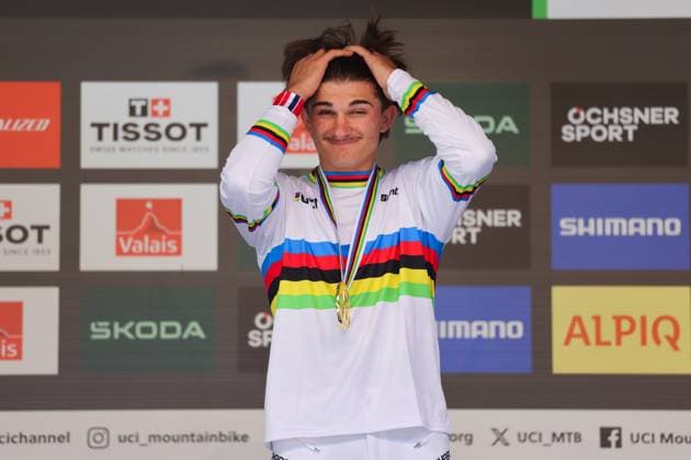 2025 UCI Mountain Bike World Championships Picture by Alex Whitehead SWpix.com - 06 09 2025 - Cycling - 2025 UCI Mountain Bike World Championships - Downhill - ChampÃ ry, Valais, Switzerland - Men Junior Final - Podium - Max Alran (France) receiving the Gold Medal to become World Champion Copyright: x xSWpix.comx(t axPhotographyxHubxLtd)xAlexxWhitehead SWpix.comx SWP-3030-2230