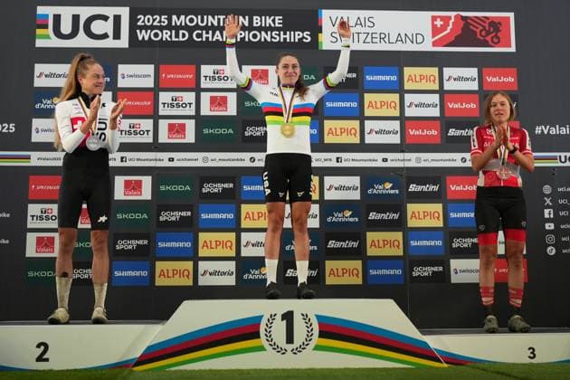 2025 UCI Mountain Bike World Championships Picture by Thomas Maheux SWpix.com - 06 09 2025 - Cycling - 2025 UCI Mountain Bike World Championships - Mountain Bike Marathon, Verbier to Val d Anniviers (Grimentz), Valais, Switzerland - Women™s Podium - Kate Courtney (United States) receiving the Gold Medal to become World Champion with Anna Weinbeer (Switzerland) receiving the Silver Medal and Mona Mitterwallner (Austria) receiving the Bronze Medal Copyright: x xSWpix.comx(t axPhotographyxHubxLtd)xThomasxMaheux SWpix.comx SWP-3030-2255
