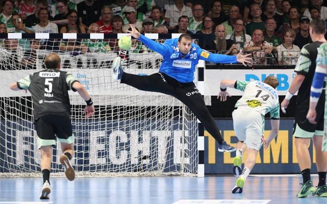 Omar Ingi Magnusson scores a goal against goalkeeper Dejan Milosavljev duel Game scene Action Sport Handball HBL Bundesliga Men 3 Matchday Season 2025 2026 06 09 2025 Füchse Berlin vs SC Magdeburg SCM