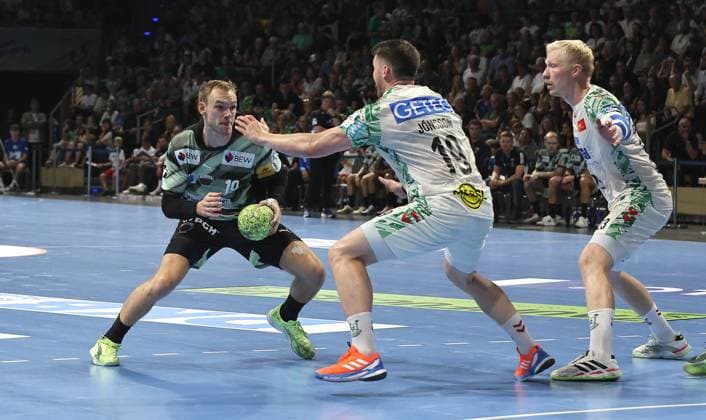 Mathias Gidsel on the ball, Elvar Örn Jonsson duel Game scene Action Sport Handball HBL Bundesliga Men 3 Matchday Season 2025 2026 06 09 2025 Füchse Berlin vs SC Magdeburg SCM