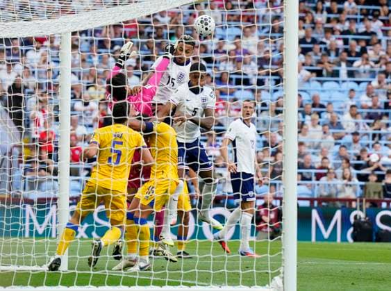 Birmingham, England, 6th September 2025. Morgan Rogers of England attempts to connect with a header as Iker Alvarez of Andorra closes in during the England vs Andorra FIFA World Cup, WM, Weltmeisterschaft, Fussball Qualifier match at Villa Park, Birmingham. Picture credit should read: Andrew Yates Sportimage EDITORIAL USE ONLY. No use with unauthorised audio, video, data, fixture lists, club league logos or live services. Online in-match use limited to 120 images, no video emulation. No use in betting, games or single club league player publications. SPI_118_AY_ENG_AND SPI-4113-0113