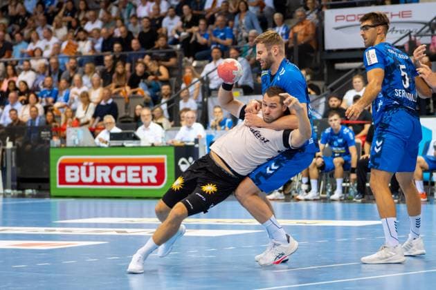Handball I Men I Season 2025 2026 I Bundesliga I Matchday 3 I TVB Stuttgart Bergischer HC I 06 09 2025 Tomas Babak 19, Bergischer HC with ball defended by Samuel Röthlisberger 17, TVB Stuttgart Stuttgart Porsche Arena Baden Württemberg Germany Copyright: xLobeca MaxxPetershansx