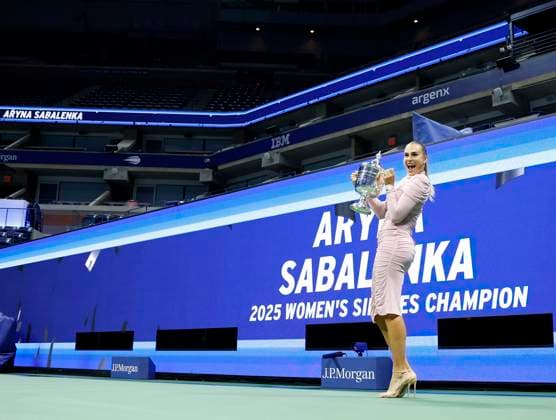 Aryna Sabalenka of Belarus gets spruced up,and brings her US Open Championship Trophy into Arthur Ashe Stadium for photos after defeating Amanda Anisimova at the Women s Finals of the 2025 US Open Tennis Championship in Arthur Ashe Stadium at the USTA Billie Jean King National Tennis Center in Flushing Meadows, New York on Saturday, September 6, 2025. Sabalenka defeated Anisimova 6-3, 7-6 to win her second consecutive US Open Championship.  NYP202509062205 JOHNxANGELILLO