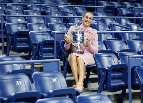 Aryna Sabalenka of Belarus gets spruced up,and brings her US Open Championship Trophy into Arthur Ashe Stadium for photos after defeating Amanda Anisimova at the Women s Finals of the 2025 US Open Tennis Championship in Arthur Ashe Stadium at the USTA Billie Jean King National Tennis Center in Flushing Meadows, New York on Saturday, September 6, 2025. Sabalenka defeated Anisimova 6-3, 7-6 to win her second consecutive US Open Championship.  NYP20250906225 JOHNxANGELILLO