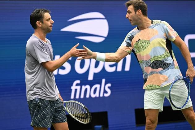 (250907) -- NEW YORK, Sept. 7, 2025 -- Marcel Granollers (R) Horacio Zeballos celebrate scoring during the men s doubles final match between Marcel Granollers of Spain Horacio Zeballos of Argentina and Joe Salisbury Neal Skupski of Britain at the 2025 US Open tennis championships in New York, the United States, Sept. 6, 2025. ) (SP)U.S.-NEW YORK-TENNIS-US OPEN-MEN S DOUBLES-FINAL LixRui 